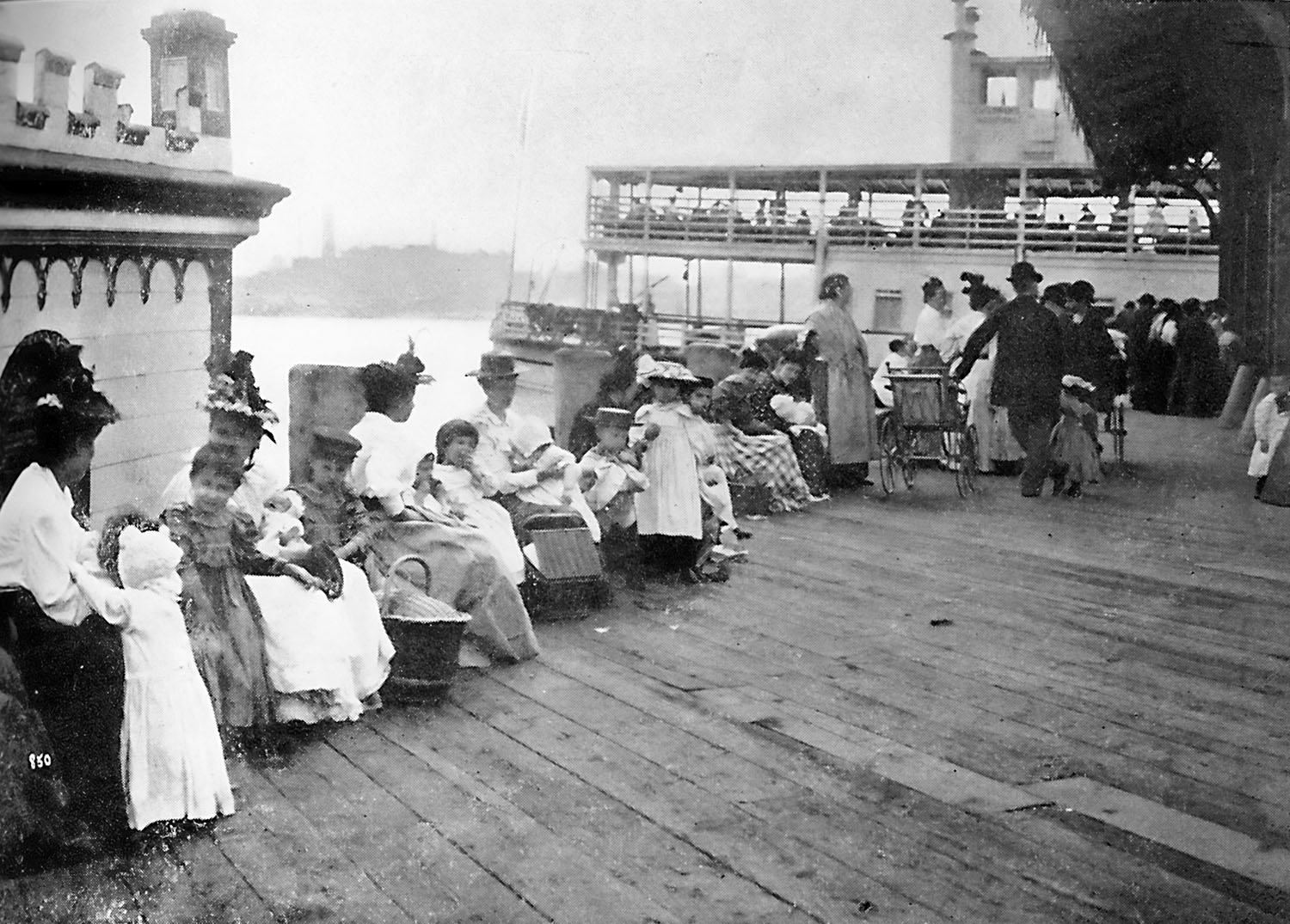 Women and children waiting on dock, to board The Floating Hospital, 1895