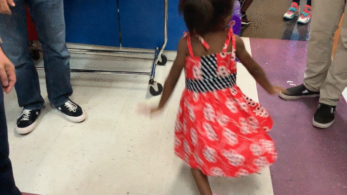 little girl spinning in one of carol's dresses